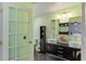 Bright bathroom with double sinks, storage and green walls at 607 Green Briar Blvd, Altamonte Springs, FL 32714