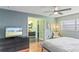 Stylish bedroom with bathroom access, ceiling fan and simple decor at 607 Green Briar Blvd, Altamonte Springs, FL 32714