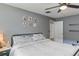 Comfortable bedroom with neutral walls, fan and white bedding at 607 Green Briar Blvd, Altamonte Springs, FL 32714
