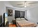 Bedroom featuring hardwood floors, dark curtains and Bruce Lee decor at 607 Green Briar Blvd, Altamonte Springs, FL 32714