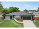 Beautiful single-story home featuring a well-manicured front yard and a spacious two-car garage at 607 Green Briar Blvd, Altamonte Springs, FL 32714