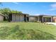 Attractive single-story home boasting a large, well-maintained front yard and a spacious two-car garage at 607 Green Briar Blvd, Altamonte Springs, FL 32714