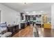 Open kitchen featuring stainless steel appliances, wooden floors and granite countertops at 607 Green Briar Blvd, Altamonte Springs, FL 32714