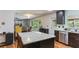 Open kitchen with stainless steel dishwasher and granite island at 607 Green Briar Blvd, Altamonte Springs, FL 32714