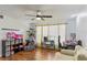 Bright living room features a ceiling fan, ample natural light, and modern flooring at 607 Green Briar Blvd, Altamonte Springs, FL 32714