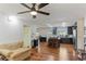 Open living room with ceiling fan, modern flooring and a view of the kitchen at 607 Green Briar Blvd, Altamonte Springs, FL 32714
