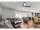 Spacious living room featuring wood floors, comfortable seating and an open kitchen at 607 Green Briar Blvd, Altamonte Springs, FL 32714
