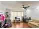 Cozy living room with a ceiling fan, natural light, and modern flooring at 607 Green Briar Blvd, Altamonte Springs, FL 32714