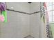 A tiled shower with a decorative shower curtain at 607 Green Briar Blvd, Altamonte Springs, FL 32714