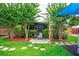 Charming backyard with a screened-in patio, lush landscaping, and stone pathway at 6430 Yellowstone St, Orlando, FL 32807