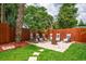 Beautiful backyard with a patio area, fire pit, and a privacy fence at 6430 Yellowstone St, Orlando, FL 32807
