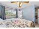 Light and bright bedroom with a ceiling fan, large windows, and direct access to the bathroom at 6430 Yellowstone St, Orlando, FL 32807