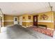 Covered carport featuring brick flooring leading to a decorated entryway and exterior doors at 6430 Yellowstone St, Orlando, FL 32807
