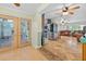 Bright kitchen boasts stainless steel appliances, tile floor, and access to an enclosed laundry room at 6430 Yellowstone St, Orlando, FL 32807