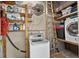 Laundry area features a washer and dryer, ladder, shelving and overhead fan at 6430 Yellowstone St, Orlando, FL 32807