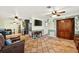 Inviting living room featuring tile floors, decorative ceiling fans, and a comfortable seating area at 6430 Yellowstone St, Orlando, FL 32807