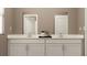 Bathroom featuring double vanity with modern faucets and neutral countertop with ample cabinet space at 669 Terrapin Dr, Debary, FL 32713