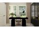 Office space with a black desk, modern lamp, and view to the outdoors at 669 Terrapin Dr, Debary, FL 32713