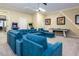 Spacious media room with sectional sofa, games, and big screen makes a great place to relax at 7398 Gathering Ct, Reunion, FL 34747