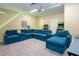 Spacious media room with sectional sofa, games, and big screen makes a great place to relax at 7398 Gathering Ct, Reunion, FL 34747