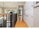 Hallway shows the dining room, stairwell, and bedroom with plenty of natural light at 7398 Gathering Ct, Reunion, FL 34747