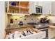 Well-equipped kitchen features granite countertops, stainless steel appliances, and ample cabinet space at 7398 Gathering Ct, Reunion, FL 34747