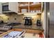 Well-organized kitchen featuring granite countertops and stainless steel appliances at 7398 Gathering Ct, Reunion, FL 34747