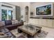 Bright living space with a television, built-in cabinets, and sliding glass doors to a pool area at 7398 Gathering Ct, Reunion, FL 34747
