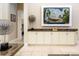 Living room featuring built-in cabinetry, granite counters, and a decorative display shelf at 7398 Gathering Ct, Reunion, FL 34747