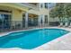 Private backyard pool with fence, patio and outdoor seating area at 7398 Gathering Ct, Reunion, FL 34747