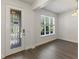 Bright entryway boasts a decorative glass door, new floors, and abundant natural light through a large window at 7816 Winter Wren St, Winter Garden, FL 34787
