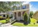 Charming two-story home featuring a welcoming front porch and professionally landscaped front yard at 7816 Winter Wren St, Winter Garden, FL 34787