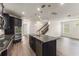 Modern kitchen featuring a central island, stainless steel appliances, and ample cabinet space at 7816 Winter Wren St, Winter Garden, FL 34787