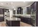 Well-equipped kitchen with stainless steel appliances, granite countertops, and a functional island at 7816 Winter Wren St, Winter Garden, FL 34787