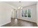 Open-concept living space featuring stylish floors, large windows, and a welcoming ambiance at 7816 Winter Wren St, Winter Garden, FL 34787