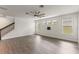 Open living room showcases new floors, a modern ceiling fan, and staircase to the upper level at 7816 Winter Wren St, Winter Garden, FL 34787