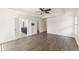Spacious main bedroom with tray ceiling, hardwood floors, and ensuite bathroom at 7816 Winter Wren St, Winter Garden, FL 34787