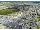 Expansive aerial view of a neighborhood highlighting the layout, landscaping, and community at 8427 Modiano St, Orlando, FL 32827