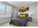 Cozy bedroom features a comfortable bed and a window that provides natural light at 8427 Modiano St, Orlando, FL 32827