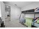 Bedroom showcasing carpet, bunk beds, and a connecting hallway at 8427 Modiano St, Orlando, FL 32827
