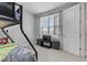 Bedroom showcasing carpet, bunk beds, a window, and a TV stand with TV at 8427 Modiano St, Orlando, FL 32827
