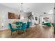 Spacious open-concept dining area featuring a modern table and chairs, flowing into the living spaces at 8427 Modiano St, Orlando, FL 32827