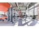 Modern gym with weightlifting machines, natural light, and a clean, well-maintained setting at 8427 Modiano St, Orlando, FL 32827