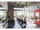 Modern fitness center featuring exercise bikes, weights, mirrors and a clean, well-maintained environment at 8427 Modiano St, Orlando, FL 32827