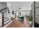 Bright open-concept living room featuring hardwood floors and modern decor, perfect for entertaining at 8427 Modiano St, Orlando, FL 32827