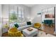 Cozy living room with a large window, comfortable seating, and bright, modern decor at 8427 Modiano St, Orlando, FL 32827