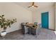Charming outdoor patio with a ceiling fan, ample seating and a bright, modern door at 8427 Modiano St, Orlando, FL 32827