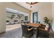 Outdoor patio featuring brick pavers, plants, a dining table, and a ceiling fan at 8427 Modiano St, Orlando, FL 32827