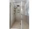 Modern bathroom shower features gray tiling, a rainfall showerhead, and a convenient built-in niche at 8427 Modiano St, Orlando, FL 32827