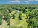 Aerial view of horse property featuring a barn and fenced paddock at 2508 Fawn Run, Oviedo, FL 32765